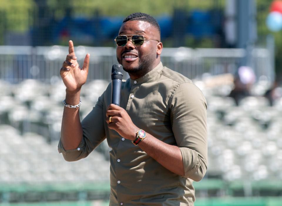 Former Stockton Mayor and Stockton Scholars founder Michael Tubbs speaks at the Rooted Rising event at the Stockton Ballpark in downtown Stockton on June 17, 2023.