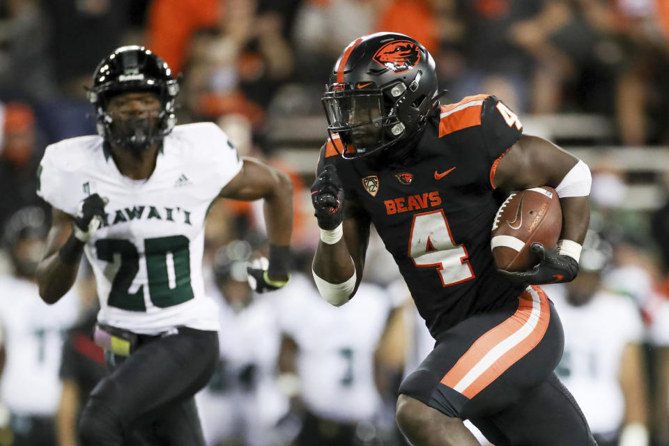 Oregon State running back B.J. Baylor (4) scores a touchdown off of a 30-yard rush during the second half of an NCAA college football game against Hawaii, Saturday, Sept. 11, 2021, in Corvallis, Ore. Oregon State won 45-27. (AP Photo/Amanda Loman)