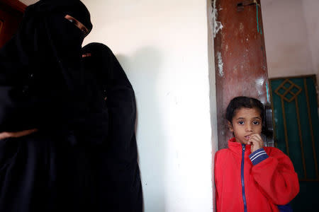 Women and a girl displaced from the Red Sea port city of Hodeidah stand at a host family's house where they live on the outskirts of Sanaa, Yemen July 10, 2018. REUTERS/Khaled Abdullah