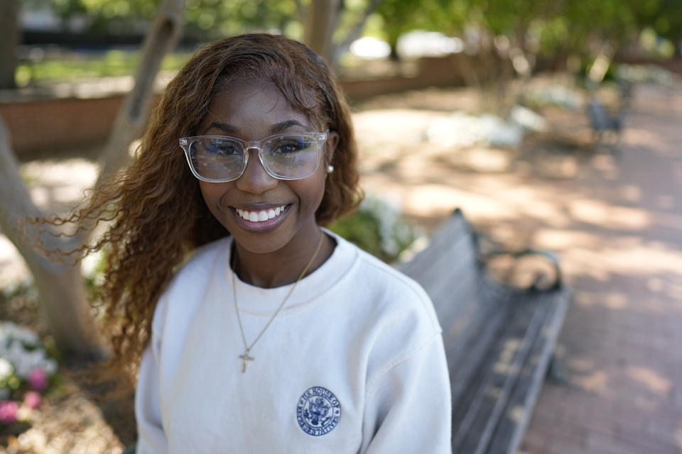 Courtney McClain, 22, a recent graduate of the University of South Carolina poses for a picture on campus on Monday, May 1, 2023, in Columbia, S.C. Black voters in South Carolina rescued Joe Biden’s bid for the presidency during the 2020 Democratic primary, and he rewarded them by moving the state to the head of the party’s nominating schedule. “He wouldn’t have been president without us,” said McClain, who voted for Biden in 2020, her first presidential election. (AP Photo/Chris Carlson)