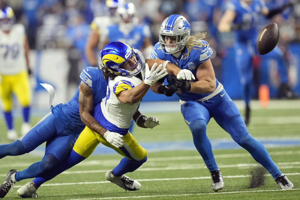Detroit Lions cornerback Cameron Sutton (1) deflects a pass intended for Los Angeles Rams wide receiver Puka Nacua (17) during the second half of an NFL wild-card playoff football game, Sunday, Jan. 14, 2024, in Detroit. (AP Photo/Paul Sancya)