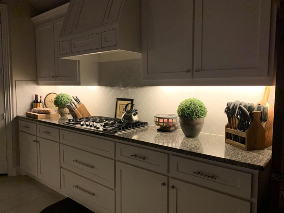 reviewer image of kitchen cabinets with lighting installed underneath