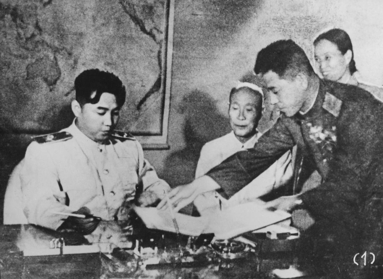 North Korean leader Kim Il Sung signs the Korean Armistice Agreement in 1953. 