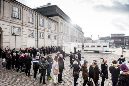 People line up in front of Christiansborg Palace Church where the Price Henrik is lying Castrum Doloris in Copenhagen, Denmark February 17, 2018. Scanpix Denmark/Mads Claus Rasmussen/via REUTERS