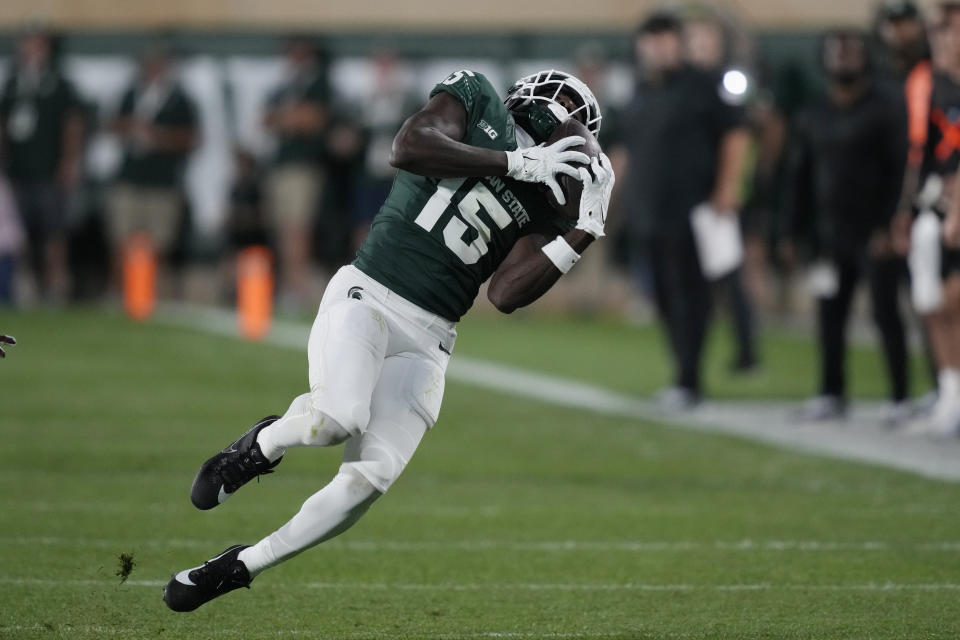 Michigan State wide receiver Jaron Glover (15) catches during the first half of an NCAA college football game against Central Michigan, Friday, Sept. 1, 2023, in East Lansing, Mich. (AP Photo/Carlos Osorio)