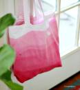 <p>Use her favorite color to give Mom a personalized bag that'll hold all of her daily essentials.</p><p><em><a href="http://www.hisugarplumsblog.com/2013/08/diy-dip-dyed-ombre-bag.html" rel="nofollow noopener" target="_blank" data-ylk="slk:Get the tutorial at Hi Sugarplum »;elm:context_link;itc:0;sec:content-canvas" class="link ">Get the tutorial at Hi Sugarplum »</a></em> </p>