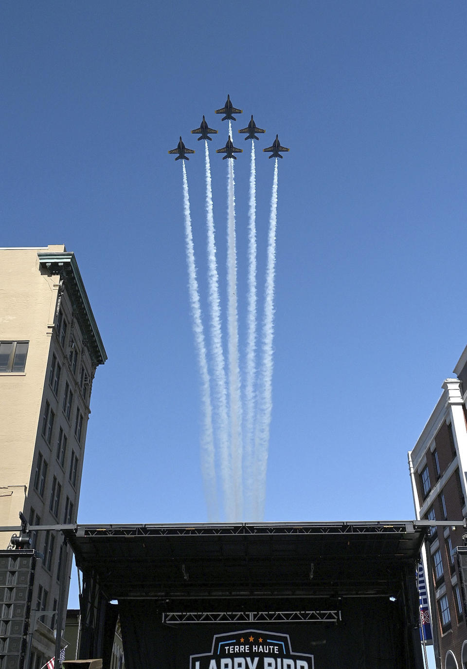 Members of the U.S. Navy Blue Angels fly over downtown Terre Haute, Ind., before the grand opening ceremony for the Larry Bird Museum, Thursday, May 30, 2024, in Terre Haute, Ind. (Joseph C. Garza/The Tribune-Star via AP)