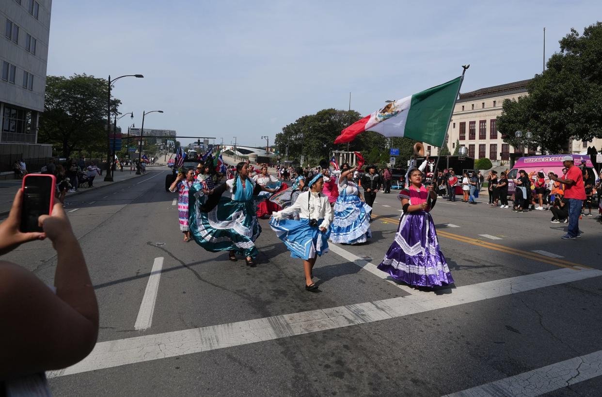 Sol y Luna performs "Ballet Folklorico" as it passes Columbus City Hall on Saturday as part of the first Columbus Latine/Hispanic Heritage Month parade.