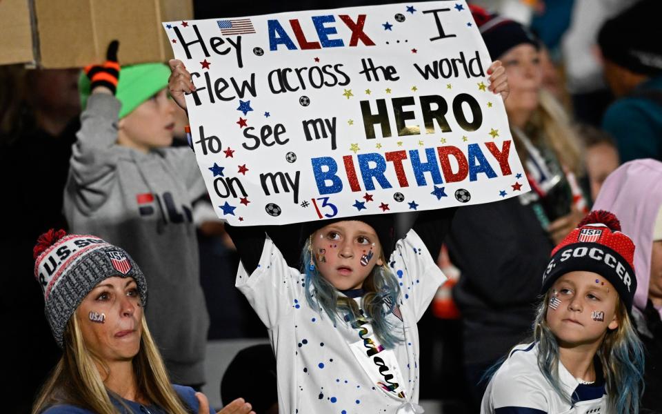 U.S. fans hold up a sign ahead of the Women's World Cup Group E soccer match between Portugal and the United States at Eden Park in Auckland, New Zealand, Tuesday, Aug. 1, 2023