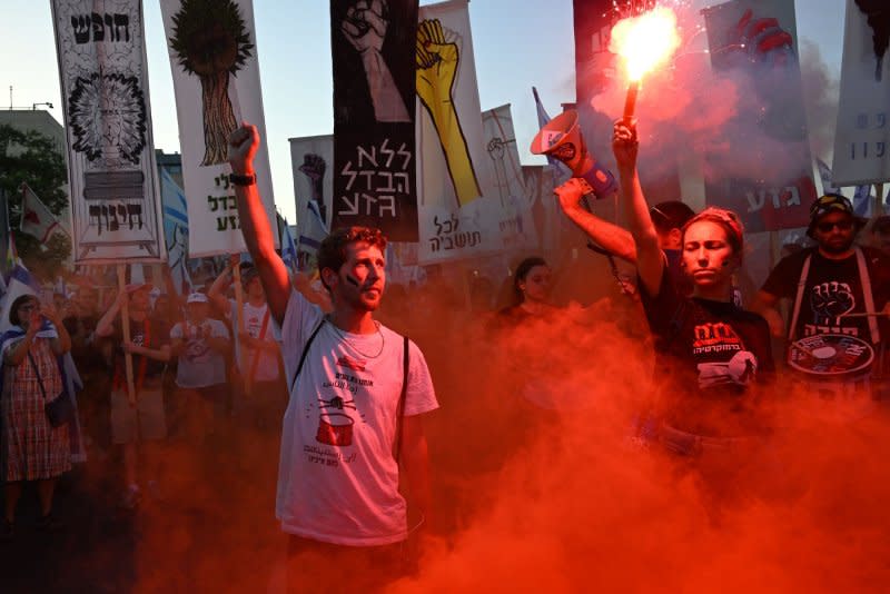 Protesters, chanting “democracy," packed in front of the Supreme Court in Jerusalem on Monday evening one day before the High Court of Justice will hear a landmark case on the country’s so-called “reasonableness” law. Photo by Debbie Hill/UPI