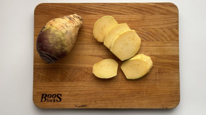 sliced rutabaga on wooden board