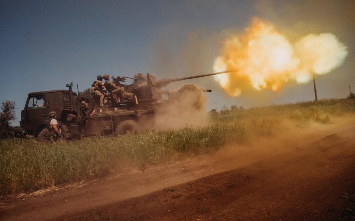 Ukrainian soldiers from the 60th Battalion of Territorial Defence, are shooting rounds into Russian positions with an S60 anti-aircraft canon placed on a truck, outside Bakhmut
