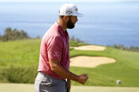 Jon Rahm, of Spain, pumps his fist after making birdie on the 13th green during the final round of the Tournament of Champions golf event, Sunday, Jan. 9, 2022, at Kapalua Plantation Course in Kapalua, Hawaii. (AP Photo/Matt York)