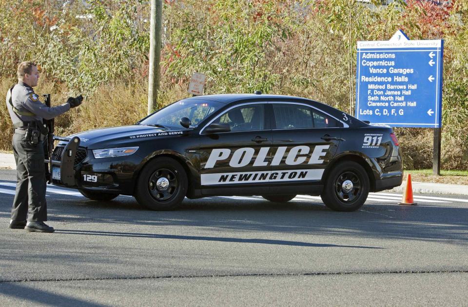 A law enforcement officer blocks access to Central Connecticut State University while it is in lockdown in New Britain, Connecticut November 4, 2013. A person has been taken into custody at Central Connecticut State University on Monday after officials locked down the campus when a suspicious person, possibly armed, was spotted on campus, said New Britain Mayor Tim O'Brien. Citing students, local media said police had searched for a person who appeared to be carrying a gun and what looked like a sword. (REUTERS/Michelle McLoughlin)