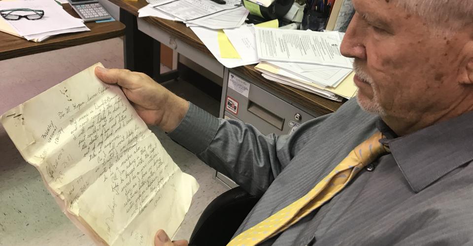 In this 2019 photo, Dan Fraley holds the 1999 letter he received from military veteran David Bauer, of Bristol. In the letter Bauer said he planned to kill himself and asked that he be buried in a veterans cemetery. He claimed he had no family to bury him.