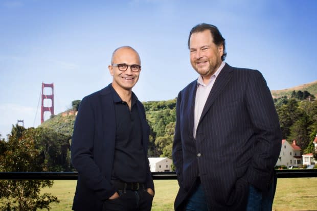 File Photo: Microsoft’s Satya Nadella and Salesforce’s Marc Benioff an.