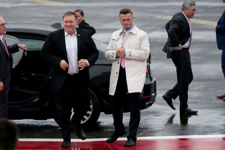 U.S. Secretary of State Mike Pompeo, left, accompanied by Andrew Kim, the head of the CIA's Korea Mission Center, right, arrives to board his plane at Yokota Air Force Base, in Fussa, Japan, Friday, July 6, 2018, to travel to Pyongyang, North Korea. Andrew Harnik/Pool via Reuters