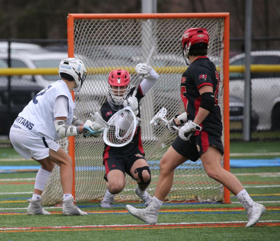 Mason Lindsay of Sparta is stopped on this shot by Mount Olive goalie Joseph Drew in the second half half of the game as Sparta topped Mount Olive 9-7 in a boys lacrosse game played at Sparta , NJ on April 6, 2022.