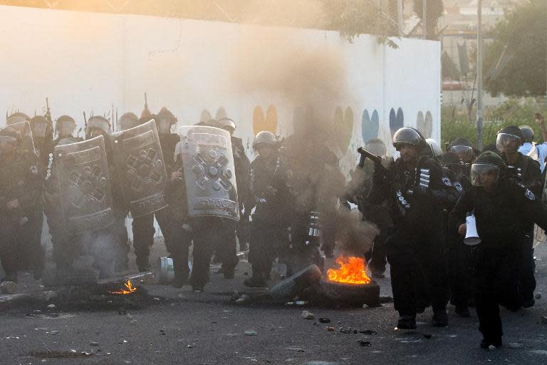 Israeli riot police secure a street during clashes with Palestinian protesters (unseen) in the Arab Israeli city of Arara, July 5, 2014