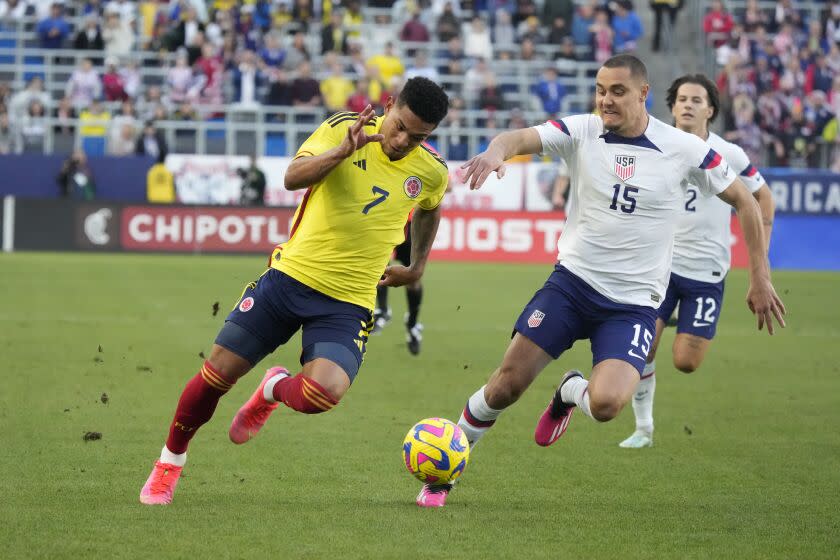 Colombia's Diego Valoyes dribbles the ball past American Aaron Long