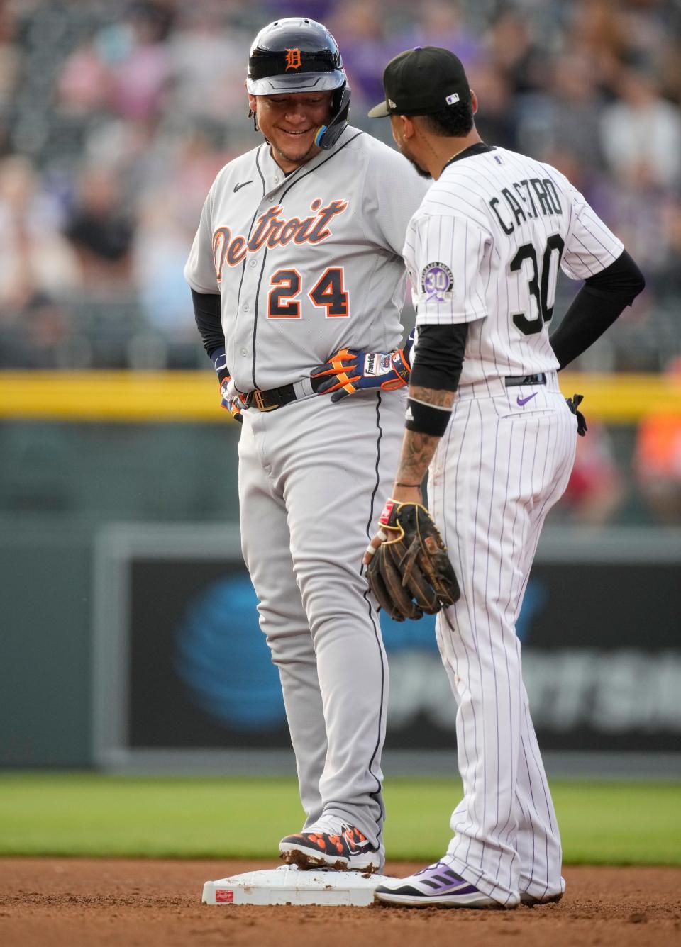 Detroit Tigers' Miguel Cabrera, left, jokes with a former teammate, Colorado Rockies second baseman Harold Castro, during the fourth inning  at Coors Field in Denver on Friday, June 30, 2023.Zalubowski)