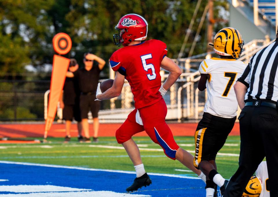 Neshaminy's Carter Clee (5) scores a touchdown against Kensington.