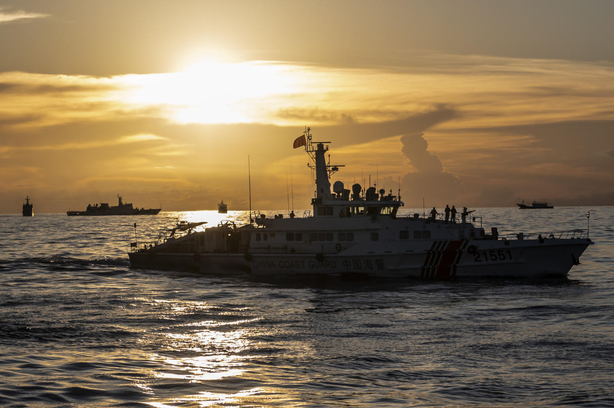 China Coast Guard ships along with other Chinese fishing vessel during a resupply mission for the BRP Sierra Madre, in the Second Thomas Shoal in the disputed South China Sea, on Friday, Nov 10, 2023. (Photographer: Lisa Marie David/Bloomberg)