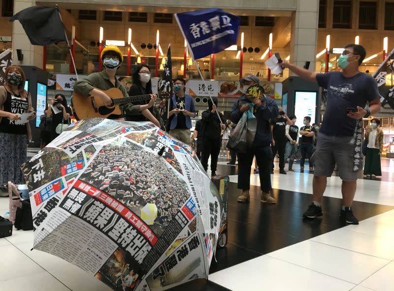 FILE PHOTO: Protesters holding banners in support of Hong Kong pro-democracy demonstrators attend a rally against the Chinese government’s newly announced national security legislation for Hong Kong, at Taipei main train station