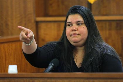 Housecleaner Carla Barbosa points to Aaron Hernandez as she testifies. (AP)