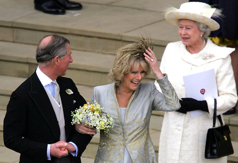 <p>The Queen smiles approvingly at Charles and his new bride Camilla, Duchess of Cornwall, after they exchanged vows at Windsor Castle.</p>
