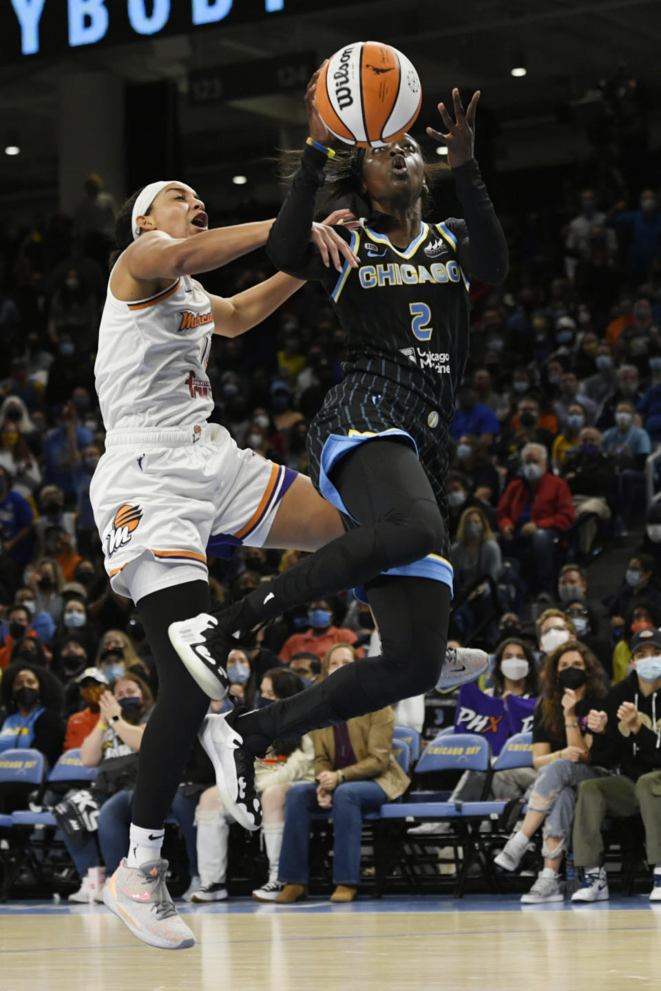 Chicago Sky's Kahleah Copper (2) goes up to shoot the basketball against Phoenix Mercury's Bria Hartley (14) during the first half of Game 3 of the WNBA Finals Friday, Oct. 15, 2021, in Chicago. (AP Photo/Paul Beaty)