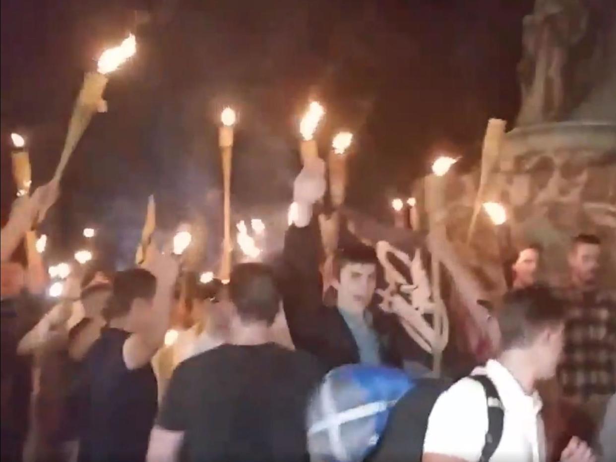 White nationalist protesters carried torches and performed Nazi salutes at the University of Virginia: @RealAlexRubi