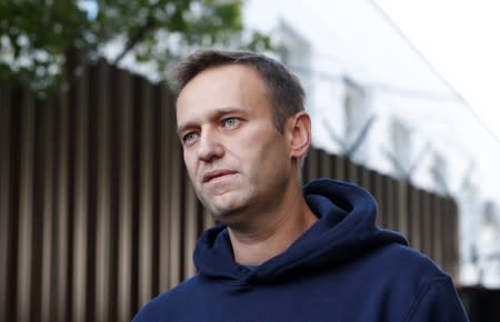 Russian opposition leader Navalny speaks with journalists outside a detention centre in Moscow