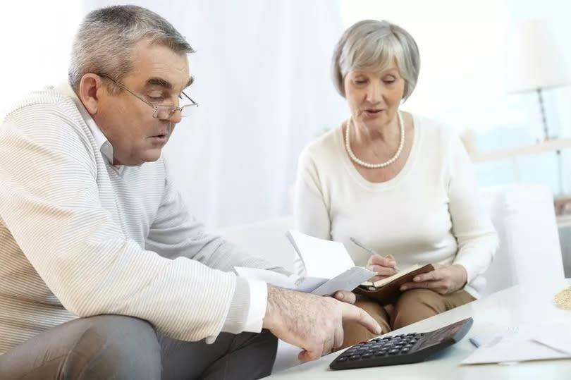 A pensioner couple checking their finances