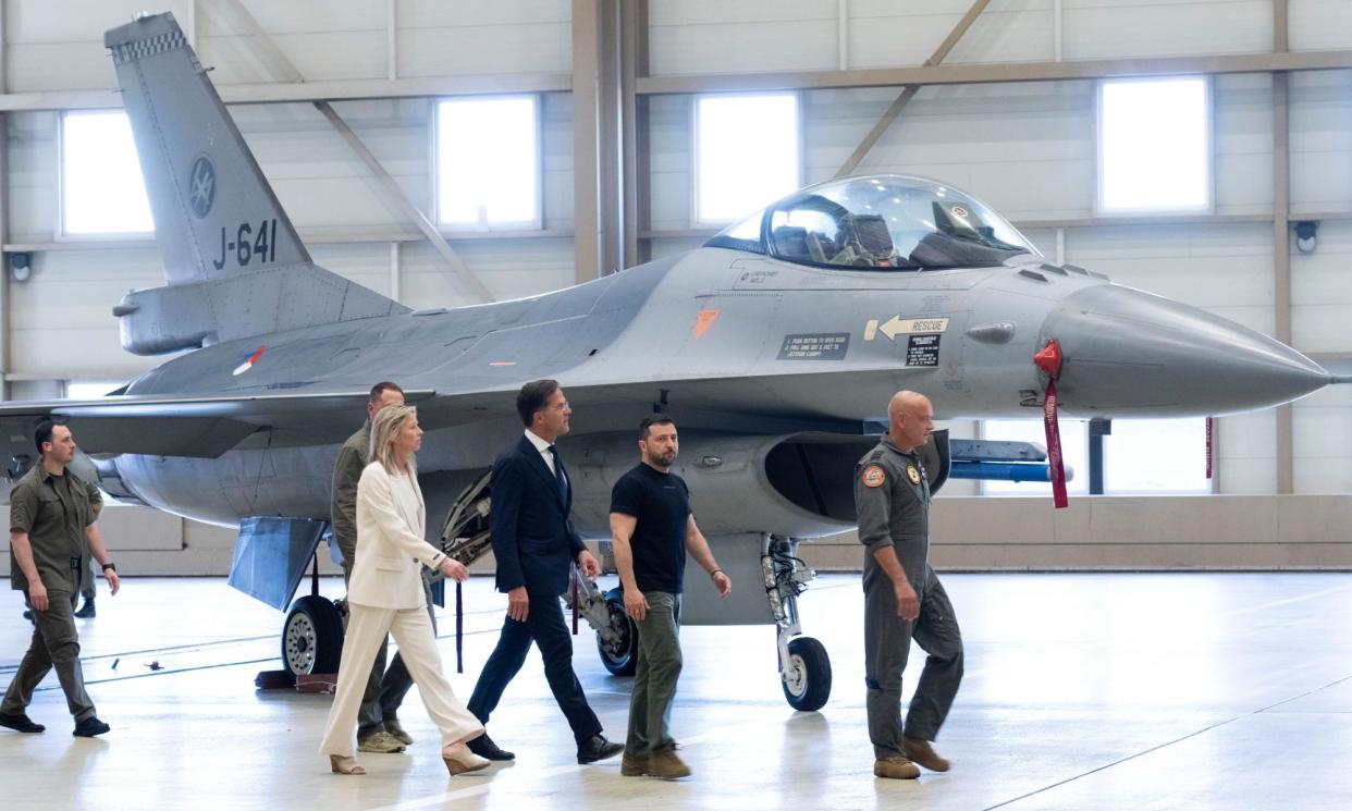 <span>The Ukrainian president, Volodymyr Zelenskiy, with the Netherlands’ prime minister, Mark Rutte, and defence minister, Kajsa Ollongren. Ollongren said the Netherlands wanted to deliver F-16s as quickly as possible.</span><span>Photograph: Peter Dejong/AP</span>