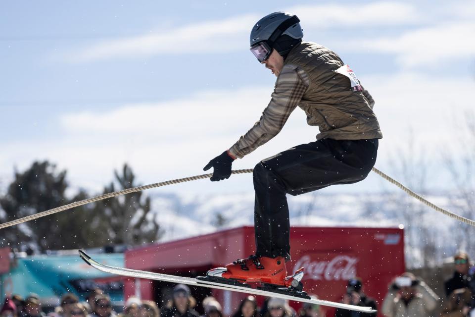 A skier is pulled by a rider over a jump during the 2024 Utah Skijoring competition at the Wasatch County Event Complex in Heber City on Saturday, Feb. 17, 2024. | Marielle Scott, Deseret News