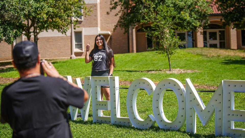 Anthony Resendez takes a few photos of sister Jade Garza as she moved into the University of Texas in August. WalletHub has again ranked Austin as America's best college town.