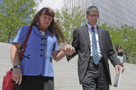 Mike and Becky Shamo, the parents of Aaron Shamo, walk from the federal courthouse Monday, Aug. 12, 2019, in Salt Lake City. Former Eagle Scout Aaron Shamo, 29, will stand trial on allegations that he and a small group of fellow millennials ran a multimillion-dollar empire from the basement of his suburban Salt Lake City home by trafficking hundreds of thousands of pills containing fentanyl, the potent synthetic opioid that has exacerbated the country's overdose epidemic in recent years. (AP Photo/Rick Bowmer)