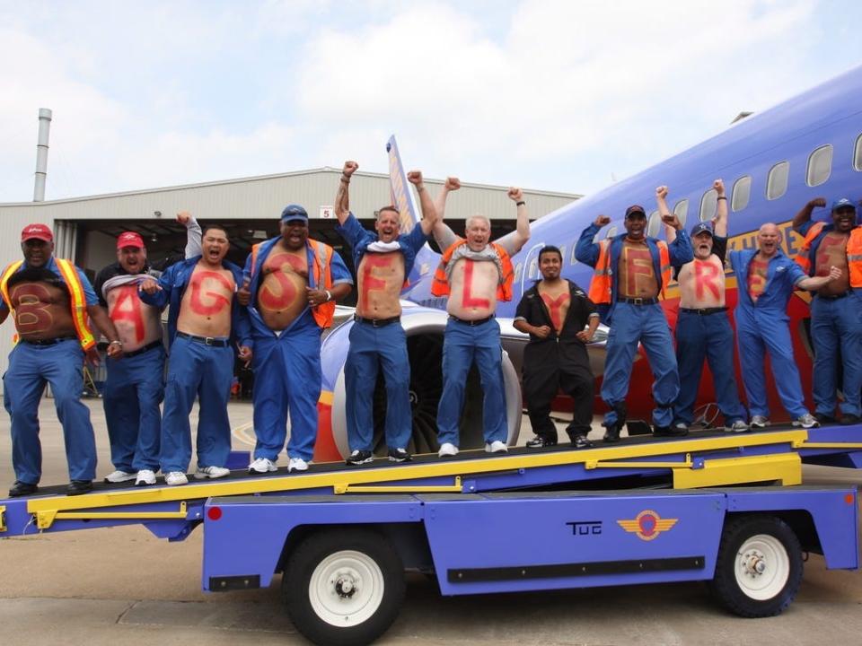 Ramp crew with Bags Fly Free on their chests