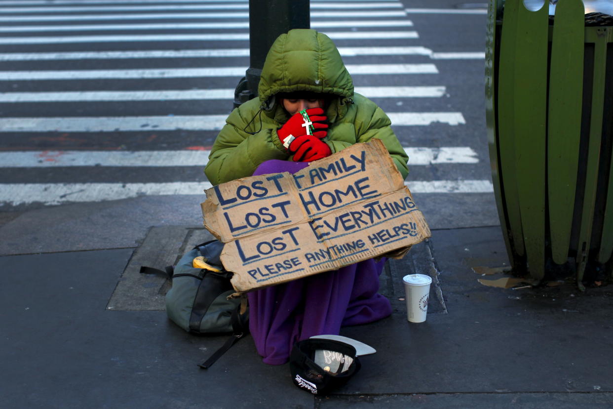 A homeless woman sits bundled against the cold in the Manhattan borough of New York City, January 4, 2016.&nbsp; (Photo: Mike Segar / Reuters)