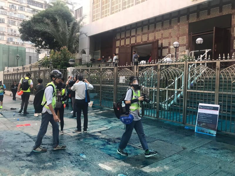 Members of the press are seen outside the Kowloon Masjid and Islamic Centre in Hong Kong, China, after police doused it with a water cannon