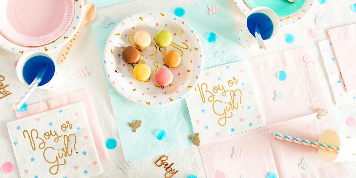 gender reveal party table with boy or girl napkins and macarons