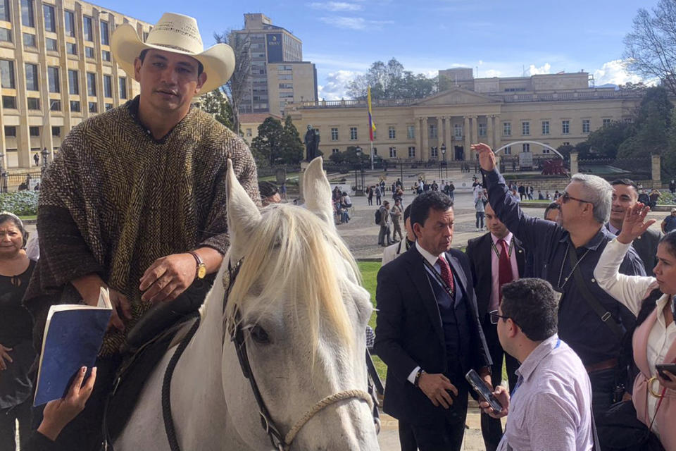 Colombian senator Alirio Barrera arrives with his horse to the Congress in Bogota on September 27, 2022.