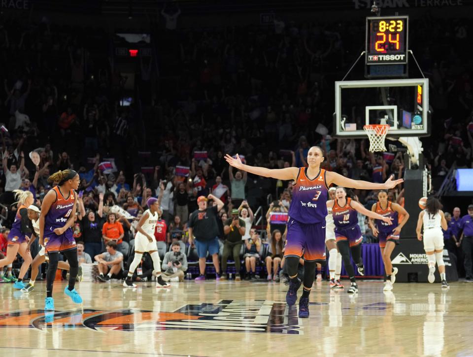 Phoenix Mercury guard Diana Taurasi celebrates after scoring her 10,000th career point.