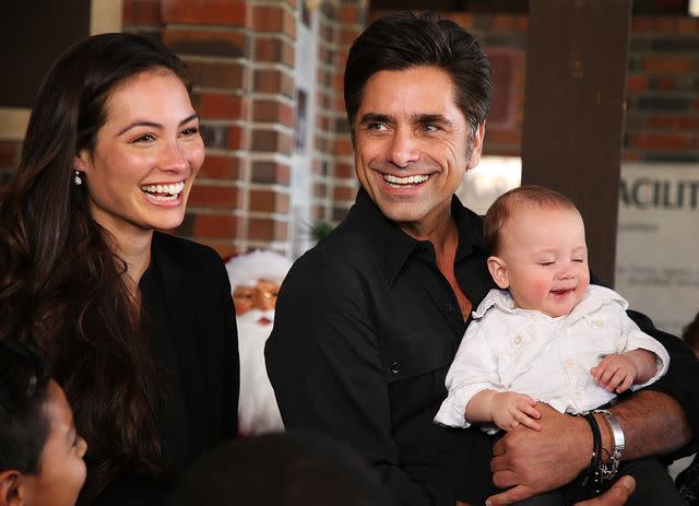 Phillip Faraone/Getty John Stamos and his wife Caitlin McHugh with their son Billy