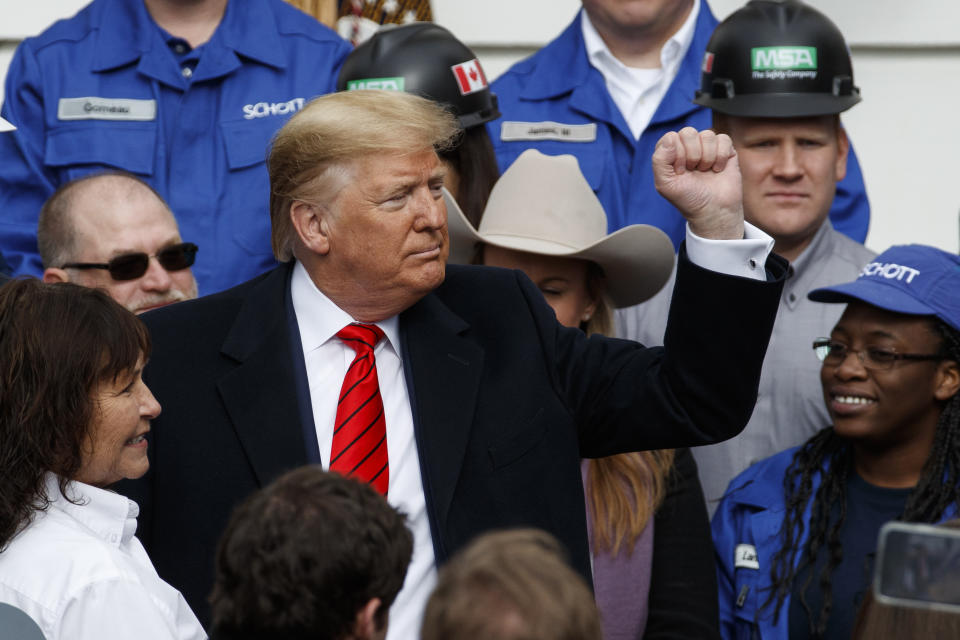 President Donald Trump pumps his fist after signing a new North American trade agreement with Canada and Mexico, during an event at the White House, Wednesday, Jan. 29, 2020, in Washington. (AP Photo/Alex Brandon)