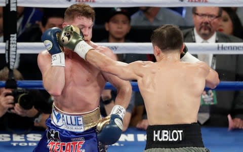 Gennady Golovkin, right, fights Canelo Alvarez - Credit: AP