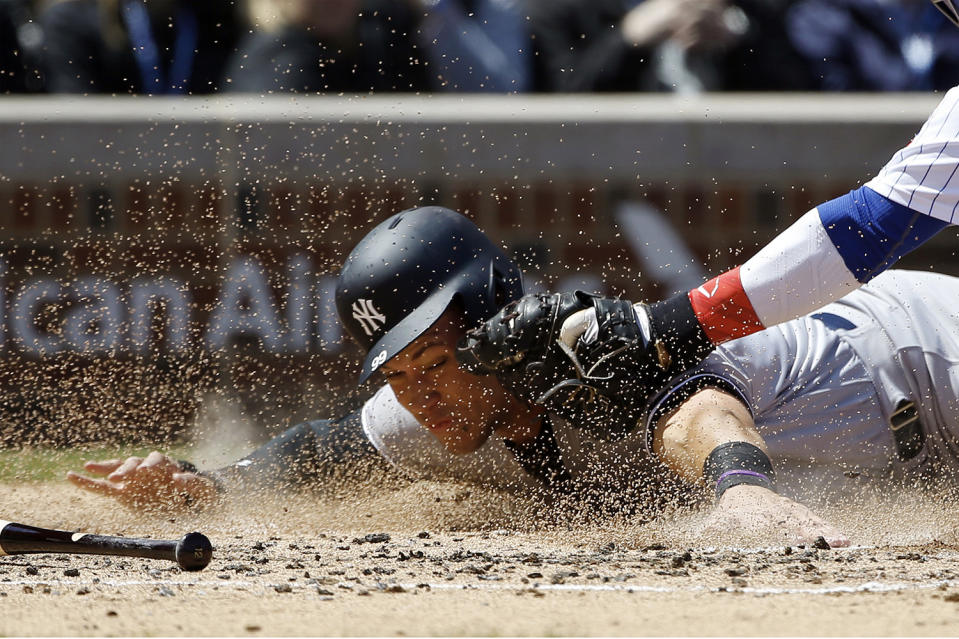 <p>New York Yankees’ Aaron Judge is tagged out at home plate by Chicago Cubs catcher Willson Contreras during the second inning of an interleague baseball game May 5, 2017 in Chicago. (Photo: Nam Y. Huh/AP) </p>