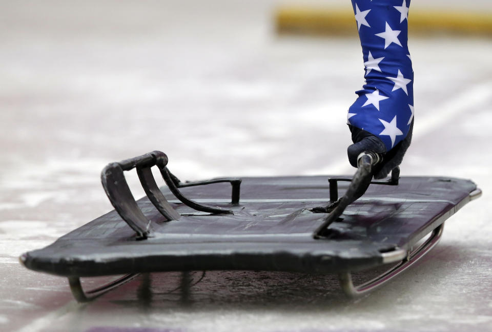 John Daly of the United States prepares to slide during the men's skeleton singles training at the 2014 Winter Olympics, Monday, Feb. 10, 2014, in Krasnaya Polyana, Russia. (AP Photo/Dita Alangkara)