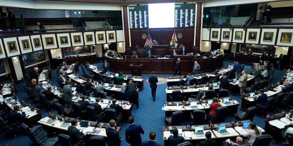 Florida Representatives work in the House during a legislative session at the Florida State Capitol, Tuesday, March 8, 2022, in Tallahassee, Fla.